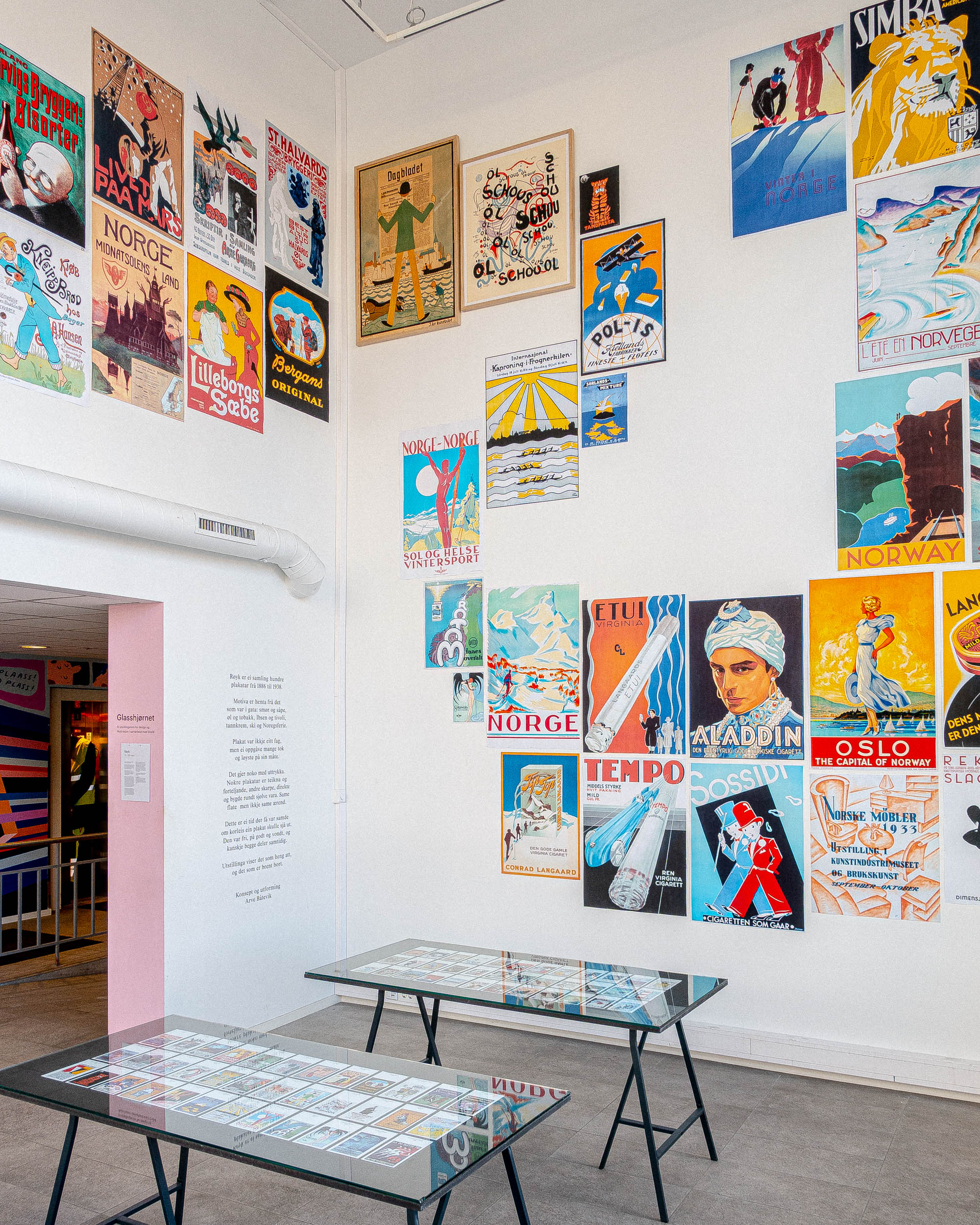 Installation view of the exhibition Røyk showing poster displays and tables